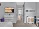 Alternate view of the bedroom with modern decor, storage, and natural light at 7238 Milestone Dr, Apollo Beach, FL 33572