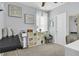 Functional bedroom with a massage table and shelving at 7238 Milestone Dr, Apollo Beach, FL 33572