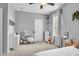 Another view of the comfortable bedroom with neutral decor and a cozy atmosphere at 7238 Milestone Dr, Apollo Beach, FL 33572