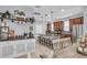 Open-concept kitchen with stainless appliances, large island, and adjacent dining area at 7238 Milestone Dr, Apollo Beach, FL 33572