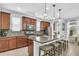 Modern kitchen with stainless steel appliances, large island, and bar seating at 7238 Milestone Dr, Apollo Beach, FL 33572