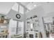 Bright living room with soaring ceilings, large windows, and decorative fireplace at 7238 Milestone Dr, Apollo Beach, FL 33572