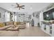 Spacious living room with neutral tones, tile flooring, and stylish decor at 7238 Milestone Dr, Apollo Beach, FL 33572