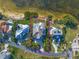 Aerial shot of property on the water with a pool, landscaping, and surrounding homes at 812 Point Seaside Dr, Crystal Beach, FL 34681
