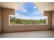 Balcony view showcasing lush green treetops and clear blue sky at 812 Point Seaside Dr, Crystal Beach, FL 34681