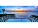 Balcony overlooking tranquil waters with a gorgeous sunset at 812 Point Seaside Dr, Crystal Beach, FL 34681