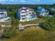 Waterfront home boasts multiple balconies, private pool, with beautiful views from the back at 812 Point Seaside Dr, Crystal Beach, FL 34681