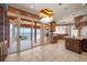 Gourmet kitchen with custom cabinetry, modern appliances, and outdoor access to a deck with ocean views at 812 Point Seaside Dr, Crystal Beach, FL 34681