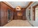 Kitchen pantry area with wine refrigerator, storage cabinets, and access to the outdoor area at 812 Point Seaside Dr, Crystal Beach, FL 34681