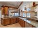 Well-appointed kitchen with custom cabinets, granite countertops, and stainless steel appliances at 812 Point Seaside Dr, Crystal Beach, FL 34681