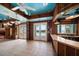 Charming living room with a bar area, tiled flooring, and outdoor access for seamless entertaining at 812 Point Seaside Dr, Crystal Beach, FL 34681
