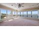Spacious living room with multiple windows showcasing scenic water views at 812 Point Seaside Dr, Crystal Beach, FL 34681