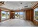 Expansive living room with sliding glass doors opening to outdoor space and lovely backyard views at 812 Point Seaside Dr, Crystal Beach, FL 34681