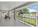 A serene screened-in balcony offers amazing lake views and comfortable outdoor living at 9223 Brindlewood Dr, Odessa, FL 33556