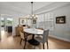 Dining area with modern light fixture and an oval table and seating for four at 9223 Brindlewood Dr, Odessa, FL 33556
