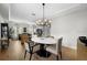 Dining area with modern light fixture and an oval table and seating for four at 9223 Brindlewood Dr, Odessa, FL 33556