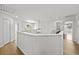 Bright hallway with wood floors and a modern chandelier at 9223 Brindlewood Dr, Odessa, FL 33556