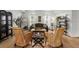 Inviting living room featuring comfortable seating, natural light, and hardwood floors at 9223 Brindlewood Dr, Odessa, FL 33556