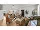 Inviting living room with hardwood floors and view to dining area at 9223 Brindlewood Dr, Odessa, FL 33556