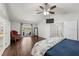Large main bedroom featuring wood floors and balcony access with seating at 9223 Brindlewood Dr, Odessa, FL 33556