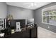 Functional home office with a view of the community pond at 9223 Brindlewood Dr, Odessa, FL 33556