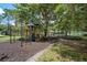 View of the community playground with various play structures and a gazebo in the background at 9223 Brindlewood Dr, Odessa, FL 33556