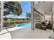 Sparkling blue pool offers luxurious lounging and stunning lake views at 9223 Brindlewood Dr, Odessa, FL 33556