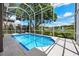 Sparkling blue pool enclosed with screen, great for outdoor enjoyment and entertaining at 9223 Brindlewood Dr, Odessa, FL 33556