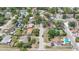 Neighborhood aerial view showcasing a mix of homes, lush greenery, and well-maintained streets at 9810 N 53Rd St, Temple Terrace, FL 33617