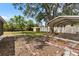 Backyard with mature tree, shed, covered parking and lots of potential at 9810 N 53Rd St, Temple Terrace, FL 33617