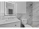 Modern bathroom features white vanity with marble countertops and tiled shower at 9810 N 53Rd St, Temple Terrace, FL 33617