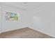 Clean, bright bedroom with modern tile flooring and a window offering natural light at 9810 N 53Rd St, Temple Terrace, FL 33617