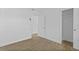 Simple, bright bedroom with modern tile flooring and a door leading to a closet at 9810 N 53Rd St, Temple Terrace, FL 33617