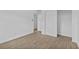 Bedroom with tile floors has closet with sliding doors for storage at 9810 N 53Rd St, Temple Terrace, FL 33617