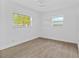 Bright bedroom features tile floors and two windows offering natural light at 9810 N 53Rd St, Temple Terrace, FL 33617