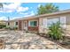 Charming single-story home with brick accents, lush landscaping, and a beautifully paved driveway at 9810 N 53Rd St, Temple Terrace, FL 33617