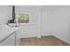 Functional laundry room with a window, tile flooring, and space for storage at 9810 N 53Rd St, Temple Terrace, FL 33617