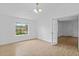 Well-lit room with tile floors, complemented by a decorative chandelier and French doors at 9810 N 53Rd St, Temple Terrace, FL 33617