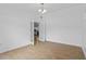 Open room with tile floors, a chandelier, and French doors leading to another space at 9810 N 53Rd St, Temple Terrace, FL 33617