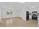 Spacious living room featuring tile floors, abundant natural light, and an open layout at 9810 N 53Rd St, Temple Terrace, FL 33617