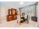 Formal dining room showcases elegant decor, natural lighting, and a stylish china cabinet at 10313 Scarlet Chase Dr, Riverview, FL 33569