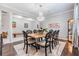 Formal dining room with elegant chandelier and seating for eight at 10313 Scarlet Chase Dr, Riverview, FL 33569