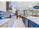 Modern kitchen features sleek countertops, stainless steel appliances, and a seamless flow into the dining area at 10313 Scarlet Chase Dr, Riverview, FL 33569