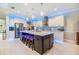 Beautiful kitchen features a large island, stainless steel appliances, and ample counter space for cooking at 10313 Scarlet Chase Dr, Riverview, FL 33569
