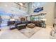 Open-concept living room leading to kitchen with view of outdoor pool area at 10313 Scarlet Chase Dr, Riverview, FL 33569