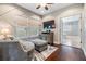 Sitting room featuring a comfortable chair, a TV, and lots of natural light, flowing into Primary bathroom at 10313 Scarlet Chase Dr, Riverview, FL 33569