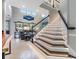 Elegant staircase with ambient lighting leading to the main living area at 10313 Scarlet Chase Dr, Riverview, FL 33569