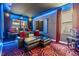 Home theater features comfortable seating, custom lighting, and a high-quality projector for immersive entertainment at 10313 Scarlet Chase Dr, Riverview, FL 33569