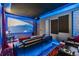Plush theater room featuring a large screen, tiered seating, and starry ceiling for ultimate viewing experience at 10313 Scarlet Chase Dr, Riverview, FL 33569