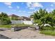 Landscaped backyard featuring a brick-paved patio and an inground planted area at 10808 Whitecap Dr, Riverview, FL 33579